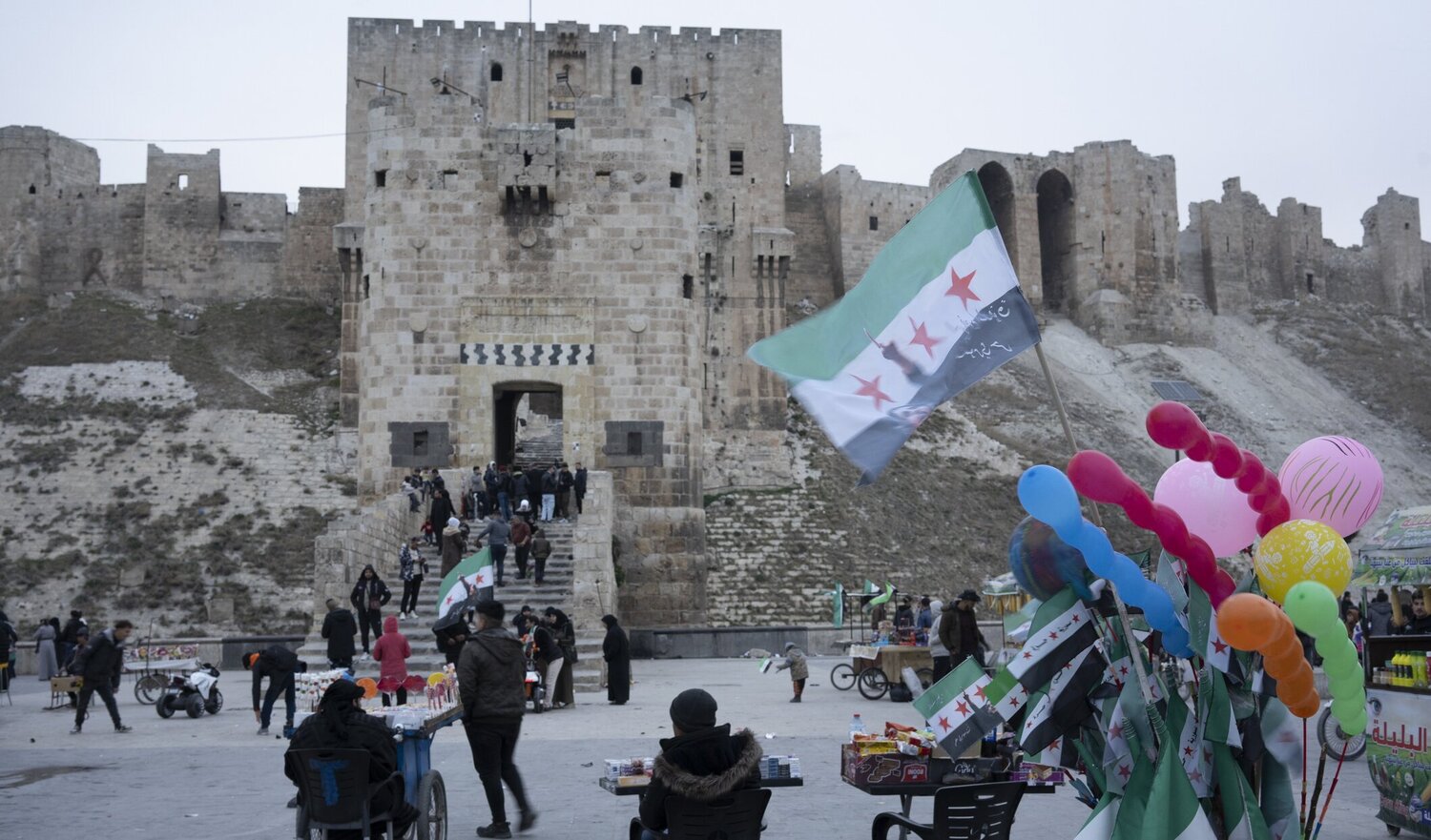 Syria: balloons on sale outside city walls in Aleppo